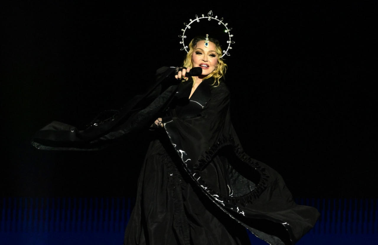 Madonna is being sued by a male fan for allegedly staging a sweaty pornography-style show
